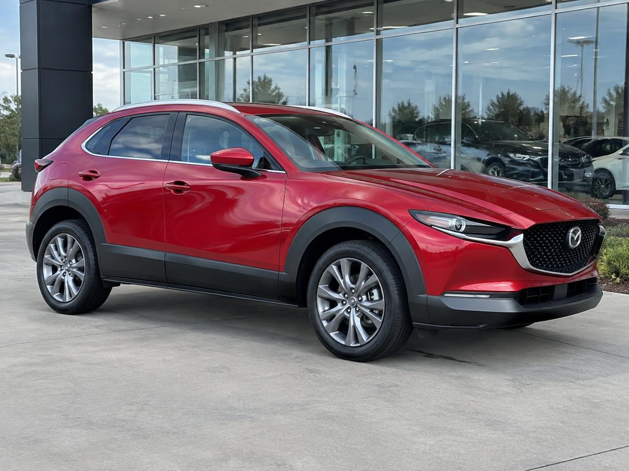 Red Mazda photographed outside a dealership